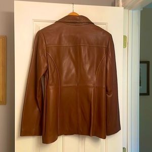 Michael Kors butter soft leather fully lined 3 button blazer. 2 zip pockets.